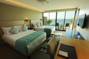 Ένα ή περισσότερα κρεβάτια σε δωμάτιο στο Hotel Poseidon