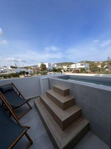 a set of stairs on the roof of a house at Poema Antiparos in Antiparos