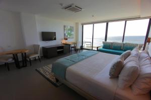 Ένα ή περισσότερα κρεβάτια σε δωμάτιο στο Hotel Poseidon