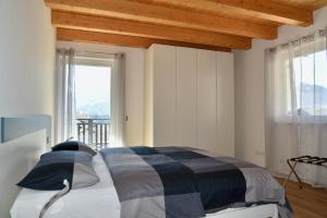 מיטה או מיטות בחדר ב-Appartamento Sogno Blu