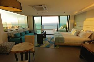 Ένα ή περισσότερα κρεβάτια σε δωμάτιο στο Hotel Poseidon