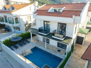 an aerial view of a house with a swimming pool at Villa Tutar 1 Marmaris Daily Weekly Rentals in Muğla