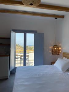Postel nebo postele na pokoji v ubytování SOHOROS suites