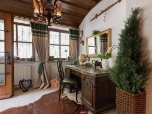 an office with a wooden desk and a christmas tree at Charming Apartment in Wei enbrunn near Forest in Weißenbrunn
