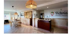 A restaurant or other place to eat at Victoria Hotel
