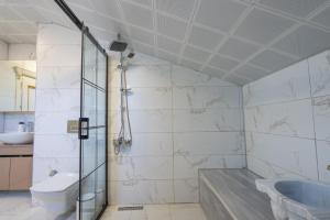 a bathroom with a shower and a toilet and a sink at Villa Tutar 2 in Marmaris