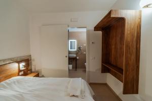Postel nebo postele na pokoji v ubytování Hotel Alla Sosta