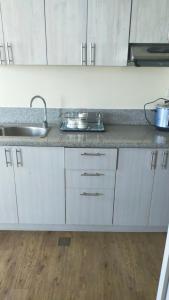 A kitchen or kitchenette at Stanford Suites 2