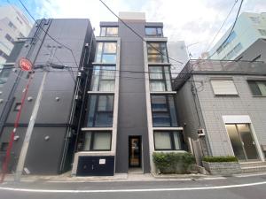 a building on the corner of a street at 民泊BNB-秋葉原や浅草が徒歩圏内です-（1～2名）無料WiFi in Tokyo
