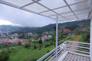 a view from the balcony of a house at Seven Endue Delight with Mountain view on the Hill Top in Ooty