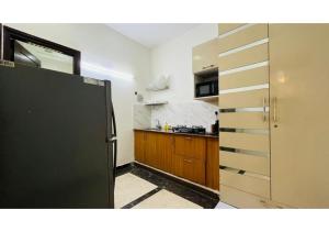 Η κουζίνα ή μικρή κουζίνα στο BluO Studio - M Block Mkt Greater Kailash