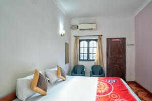Ένα ή περισσότερα κρεβάτια σε δωμάτιο στο Om Sai Guest House