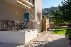 a balcony of a building with chairs on it at Levanda Cozy Apartments in Lefkada