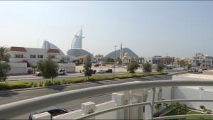 a view of a street with buildings in the background at PRIVATE ROOM WITH WASHROOM AND BALCONY in Dubai