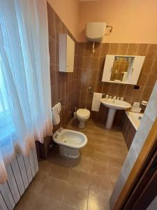 a bathroom with a toilet and a sink at ROOM365 in Lanciano