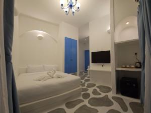 Voodi või voodid majutusasutuse Ipoh Santorini Hideaway - Hotel Inspired toas