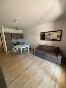 a living room with a couch and a table at Casa Lella 7 Marino in Marino