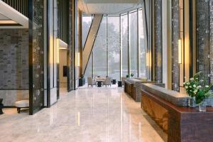 a lobby with a view of a building with windows at Kempinski Residences Guangzhou 广州德安丽舍凯宾斯基酒店 in Guangzhou