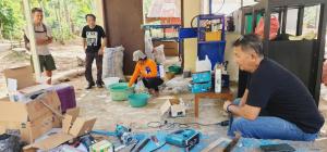 a group of people in a room with boxes at Camping Rein apwisindo desa sarawet in Likupang