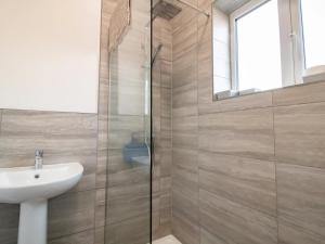 a bathroom with a sink and a glass shower at Half a mile to Beamish Museum Pass the Keys in Beamish