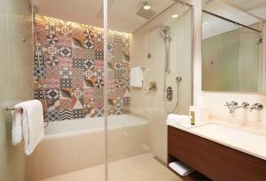 a bathroom with a shower and a sink at Shaza Riyadh in Riyadh