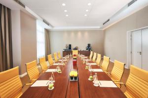 a long conference room with a long table and yellow chairs at Shaza Riyadh in Riyadh