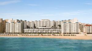 a view of the hotel from the beach at Hilton Cancun Mar Caribe All-Inclusive Resort in Cancún