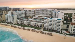 an aerial view of a resort on the beach at Hilton Cancun Mar Caribe All-Inclusive Resort in Cancún