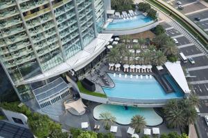 an overhead view of a building with a swimming pool at Kempinski The Boulevard Dubai in Dubai