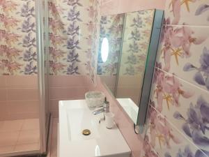 a bathroom with a sink and a mirror at Villas Rocher - Junior Suite 3B in Grand Baie