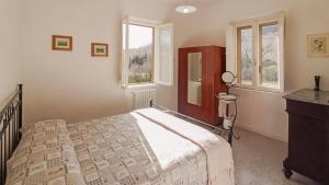 Postel nebo postele na pokoji v ubytování Il tuo casale tra le colline - Marche House