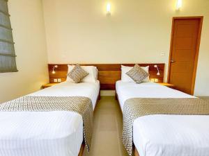 A bed or beds in a room at SUFFIX RETREAT