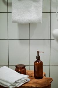 a bottle of soap on a table in a bathroom at Valleviken Hotell in Valleviken