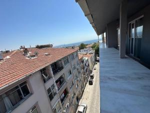 an apartment balcony with a view of a building at Good Night Hotel Istanbul in Istanbul