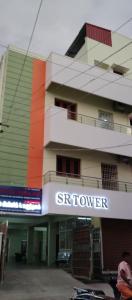 a building with a sign that reads singular at SR RESIDENCY in Chennai