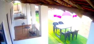 a view of a room with a table and chairs at Casa Hillary Guest House in Colva
