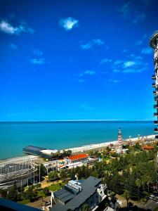 a view of a beach and the ocean at Holiday Premium Apartments Batumi in Batumi