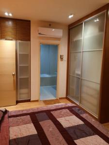 a room with a walk in closet with a glass door at Parkview KLCC ITSKAYA 11 in Kuala Lumpur