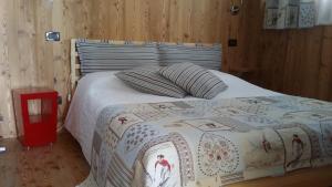A bed or beds in a room at La Stella delle Alpi