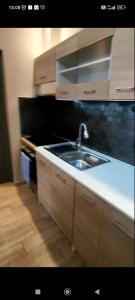 a kitchen with a sink and a counter top at Petrino in Kalamata