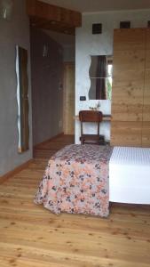 A bed or beds in a room at La Stella delle Alpi
