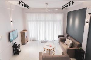 TV a/nebo společenská místnost v ubytování 居銮小云顶名宿KLUANG SMALL GENTING HOMESTAY