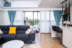 a living room with a couch and a table at Paul Apartments in Nairobi