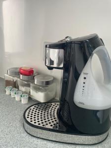 Příslušenství pro přípravu čaje a kávy v ubytování Anchor Annex