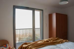 Postel nebo postele na pokoji v ubytování Duplex 6 personnes, vue panoramique sur lac