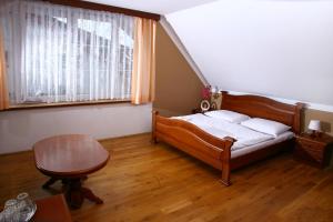 Postel nebo postele na pokoji v ubytování Penzion FAJN ***
