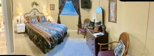 a bedroom with a bed and a tub in a room at Monroe Street Suites in Pittsfield