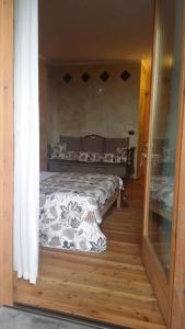 A bed or beds in a room at La Stella delle Alpi