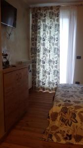 A bed or beds in a room at La Stella delle Alpi