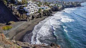 an aerial view of a beach with white buildings at Acogedor y vistas al mar in Maspalomas